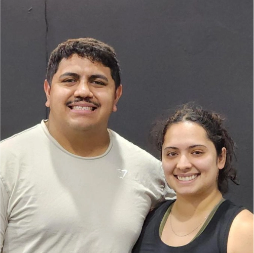 A man and a woman standing next to each other.